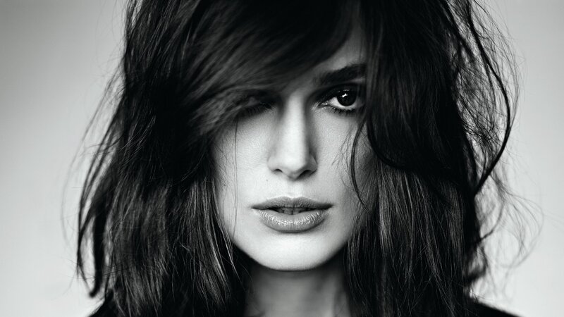 woman with dark hair in black and white
