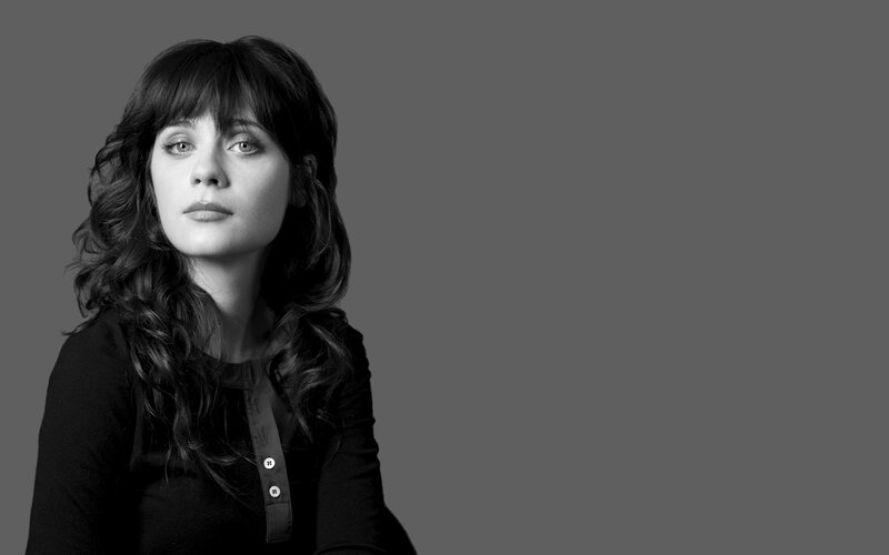woman with dark hair in black and white