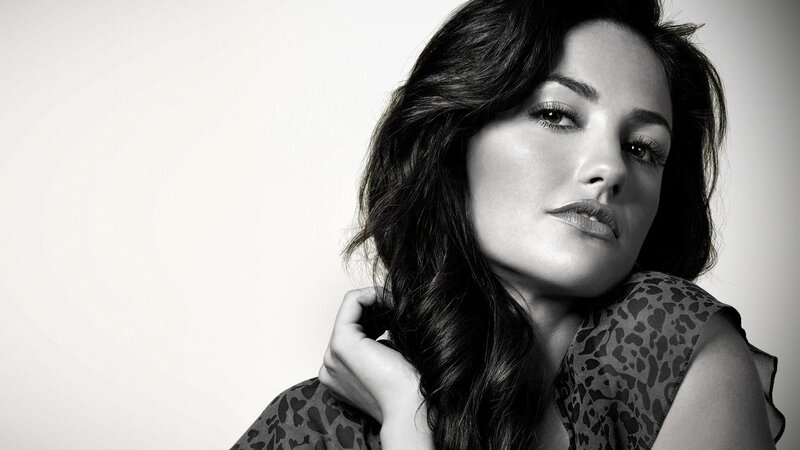 woman with dark hair in black and white