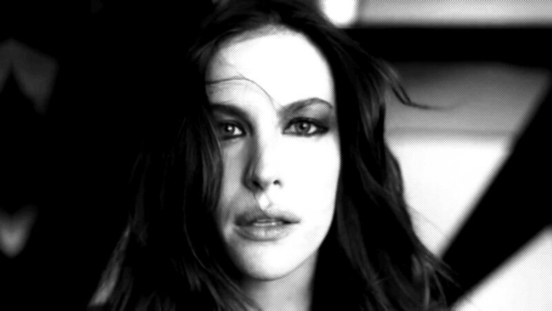 woman with dark hair in black and white