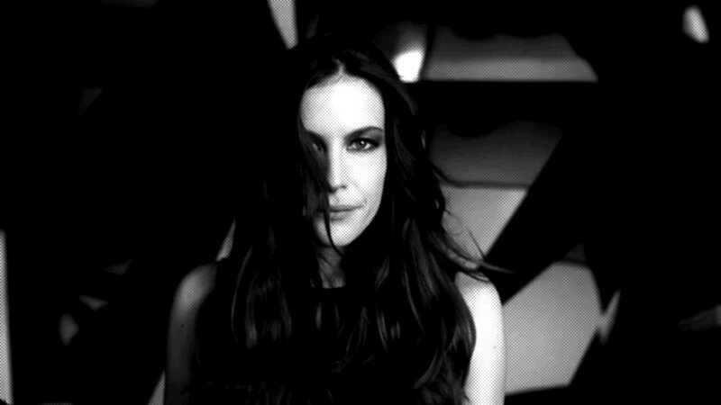 woman with dark hair in black and white