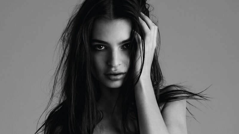 woman with dark hair in black and white