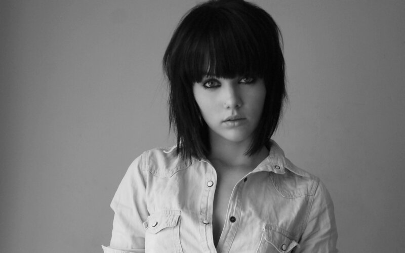 woman with dark hair in black and white