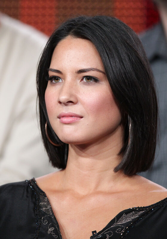 woman with dark hair in black top