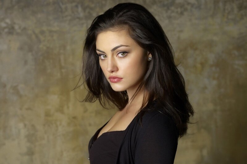 woman with dark hair in black top