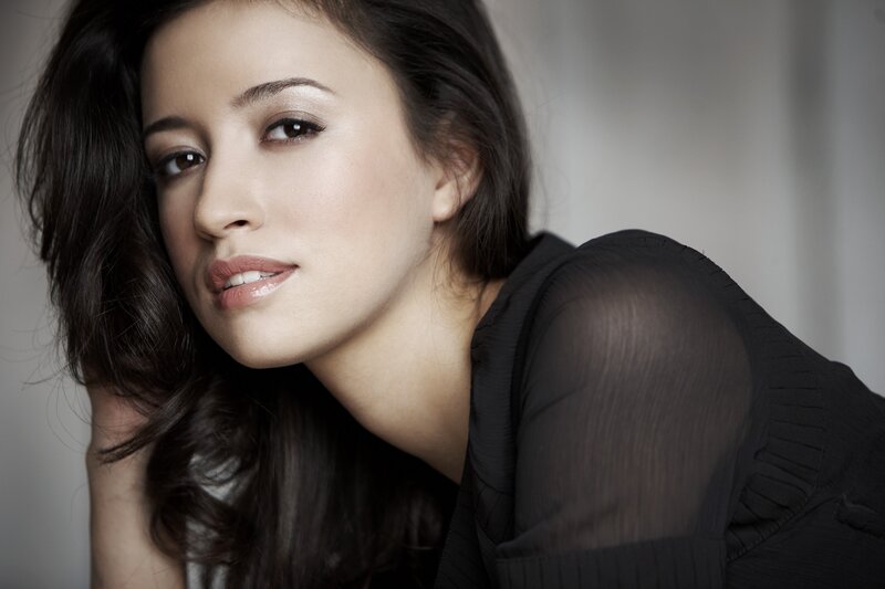 woman with dark hair in black top