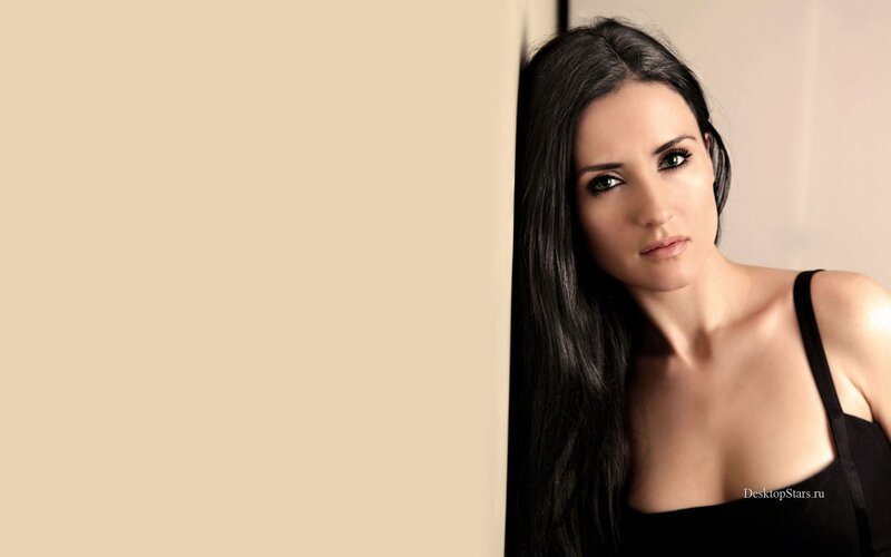 woman with dark hair in black top