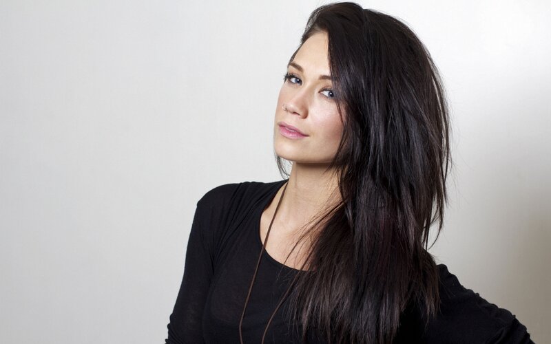 woman with dark hair in black top