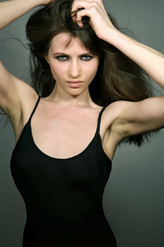 woman with dark hair in black top