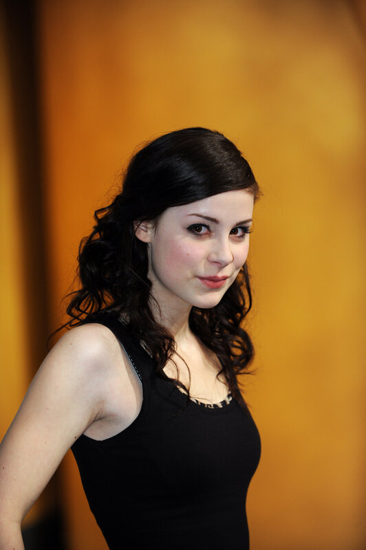 woman with dark hair in black top