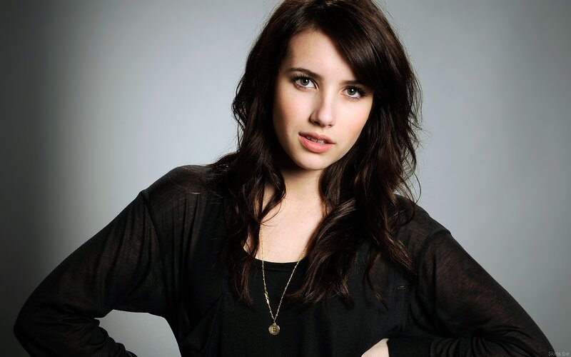 woman with dark hair in black top