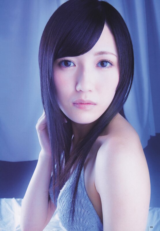 woman with dark hair in blue light