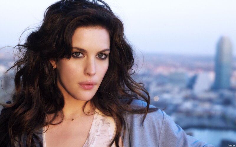 woman with dark hair in city view