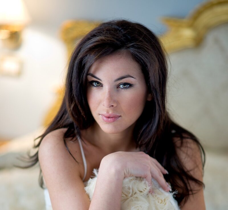 woman with dark hair in elegant setting