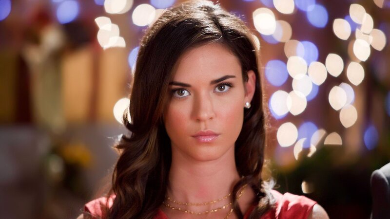 woman with dark hair in festive setting