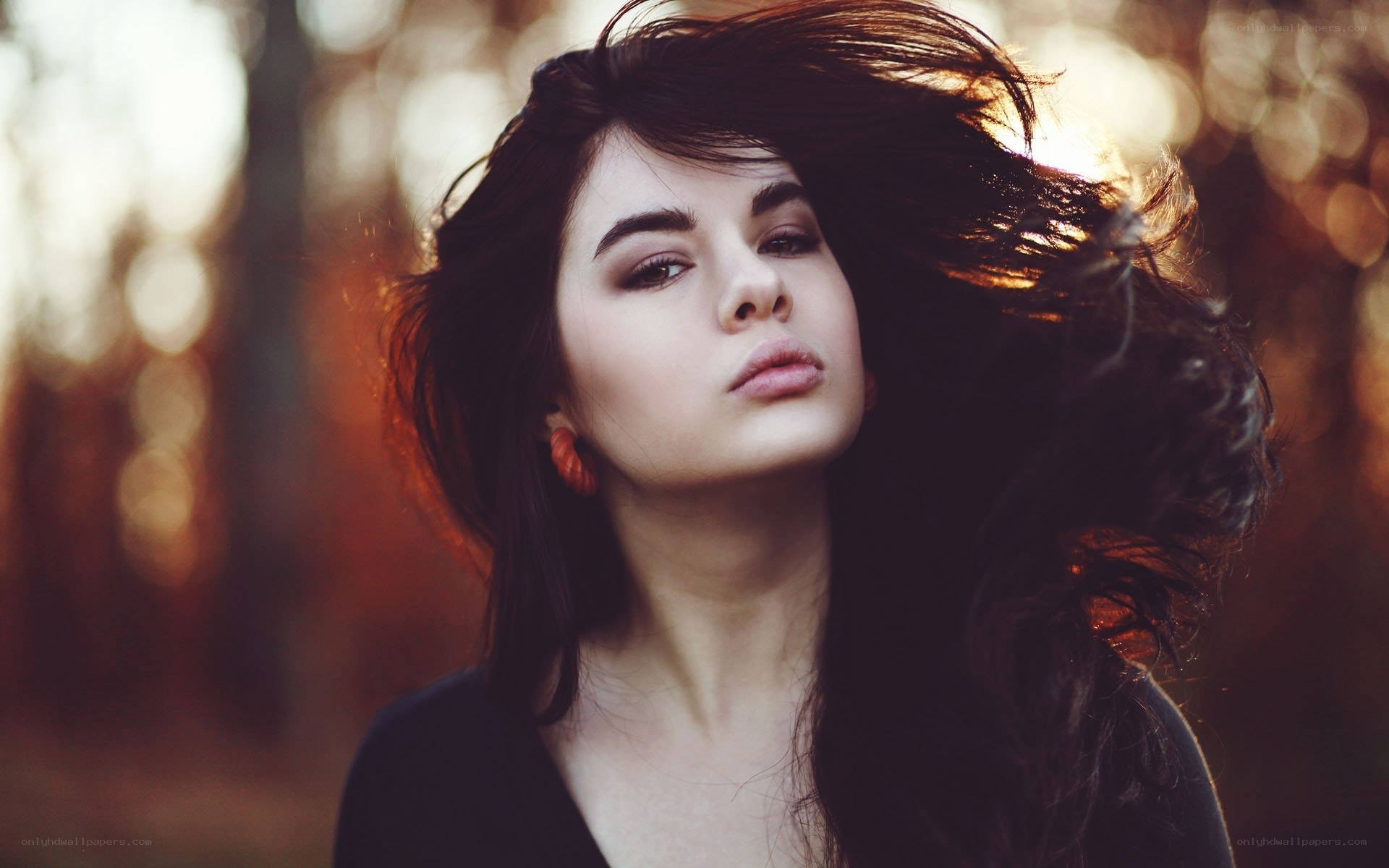 woman with dark hair in forest