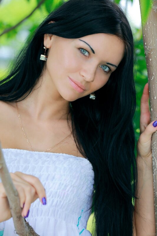 woman with dark hair in garden