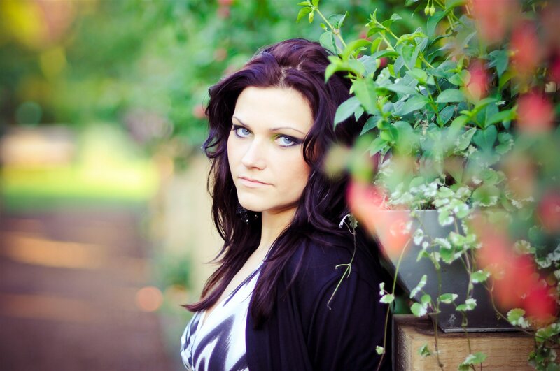 woman with dark hair in garden