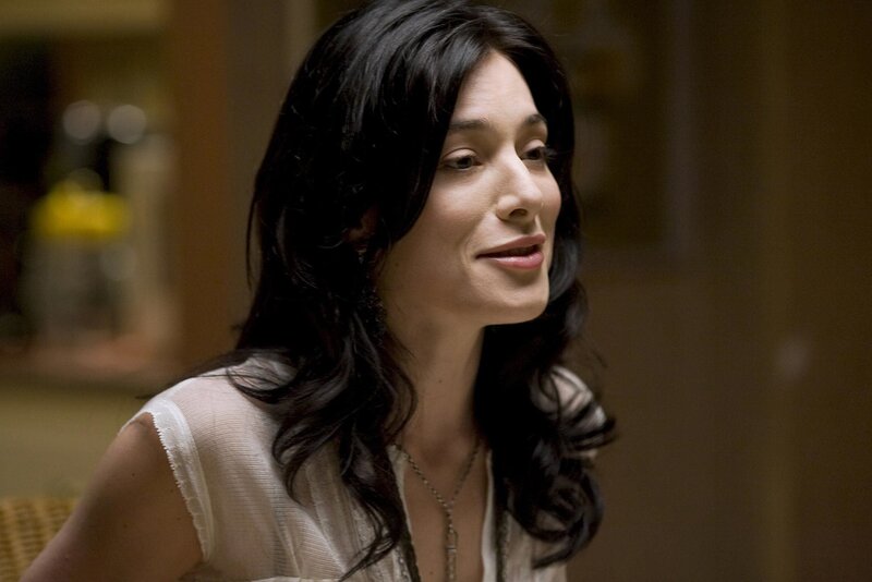 woman with dark hair in interior
