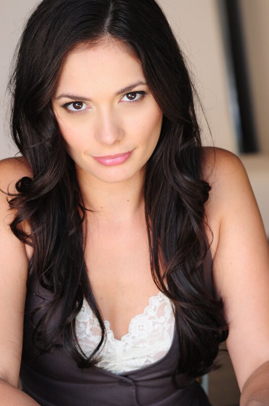woman with dark hair in lace top