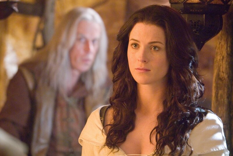 woman with dark hair in medieval setting