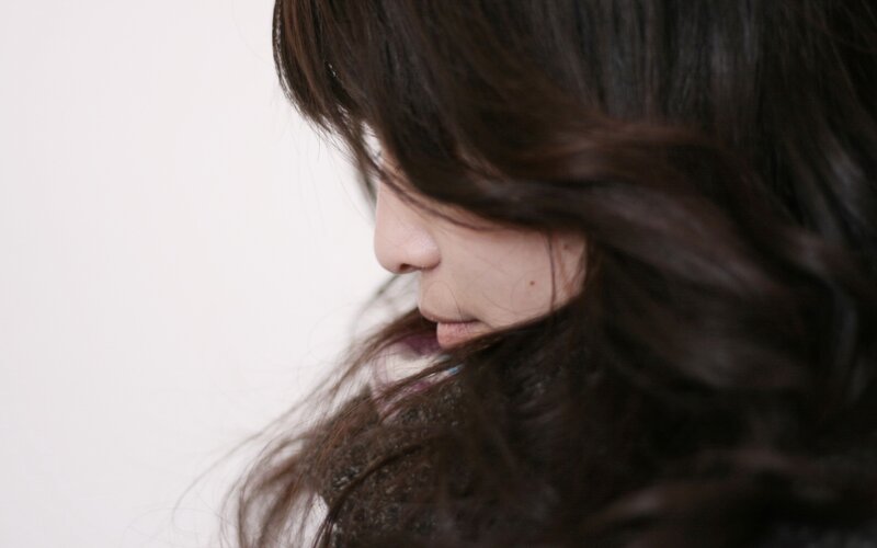 woman with dark hair in profile