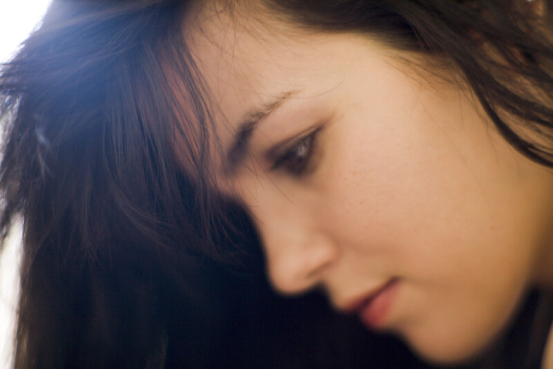 woman with dark hair in profile