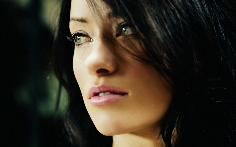 woman with dark hair in profile