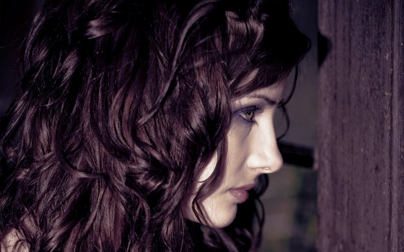 woman with dark hair in profile