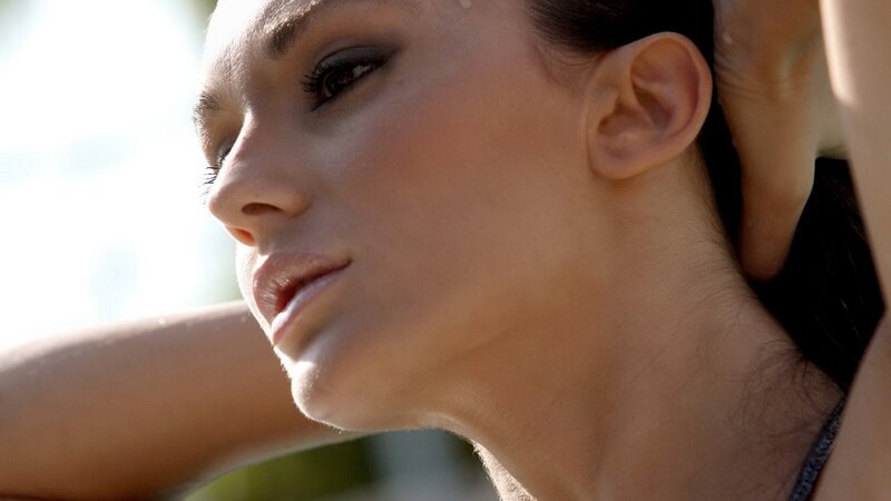 woman with dark hair in profile