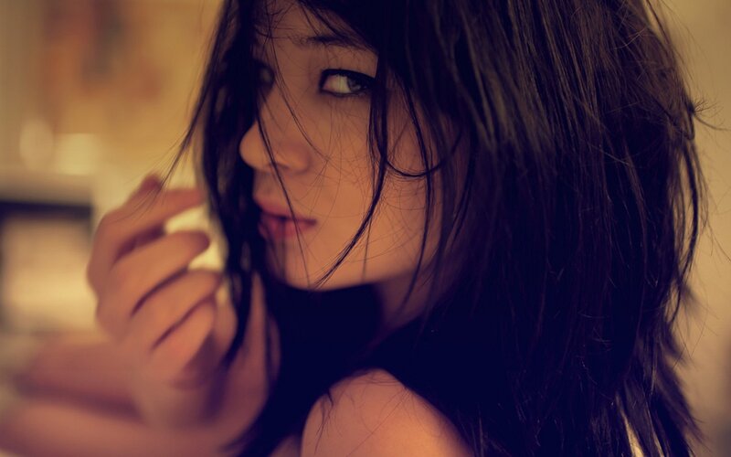 woman with dark hair in profile