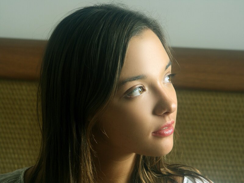 woman with dark hair in profile