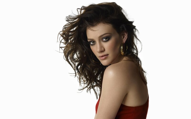 woman with dark hair in red dress