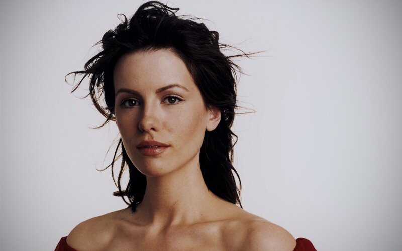 woman with dark hair in red dress