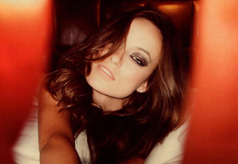 woman with dark hair in red setting