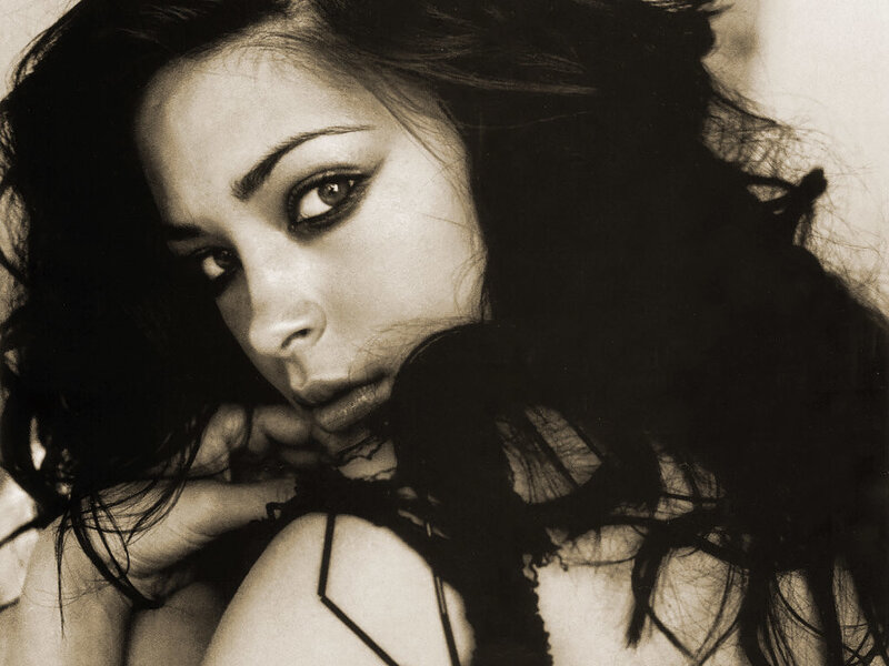 woman with dark hair in sepia