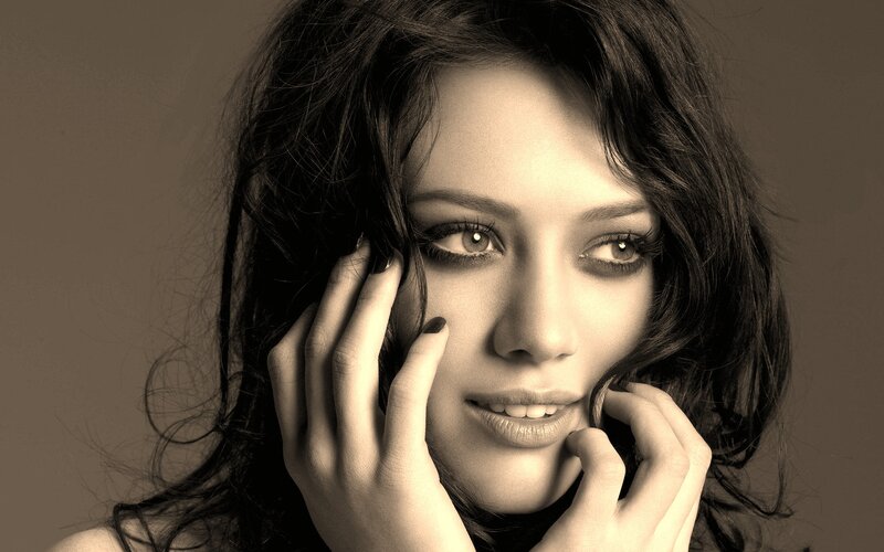 woman with dark hair in sepia