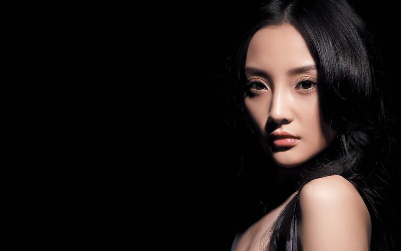 woman with dark hair in studio
