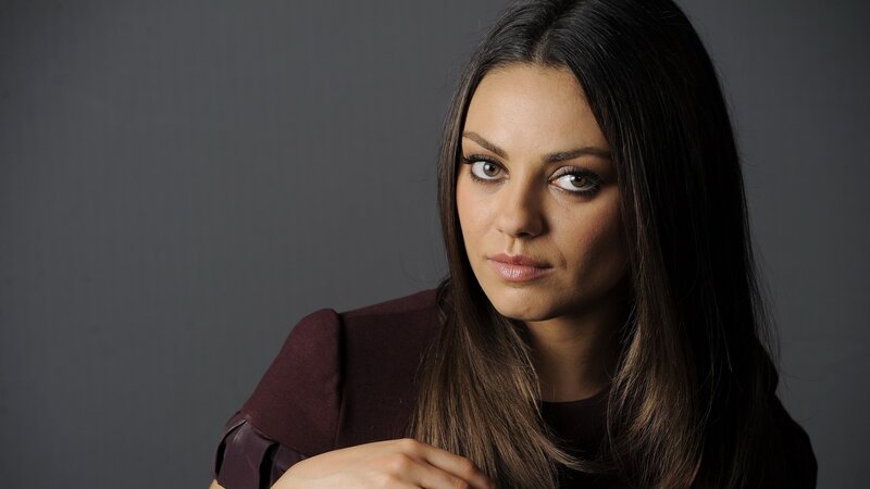 woman with dark hair in studio