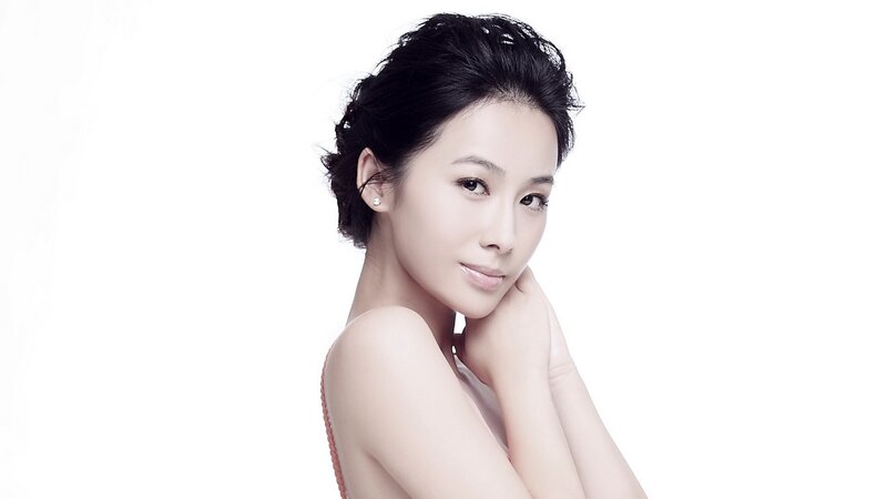 woman with dark hair in studio