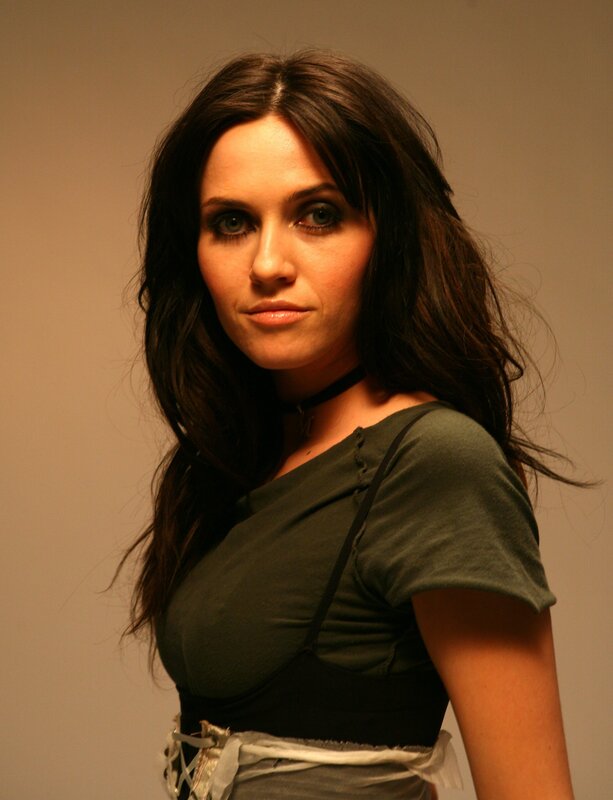woman with dark hair in studio