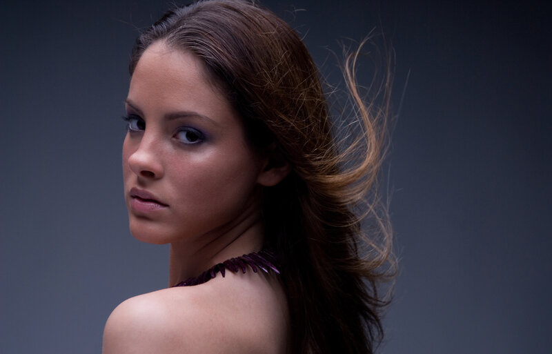 woman with dark hair in studio