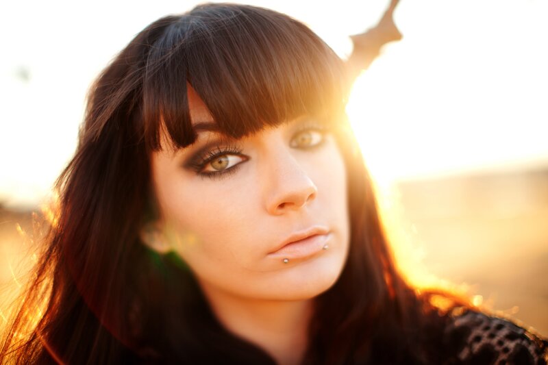 woman with dark hair in sunlight