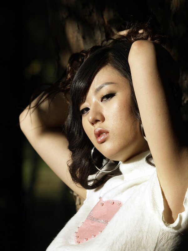 woman with dark hair in sunlight