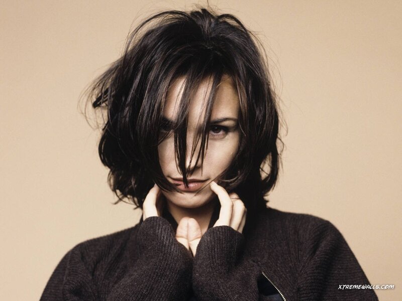 woman with dark hair in sweater