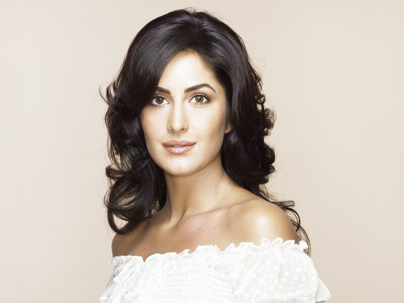 woman with dark hair in white top