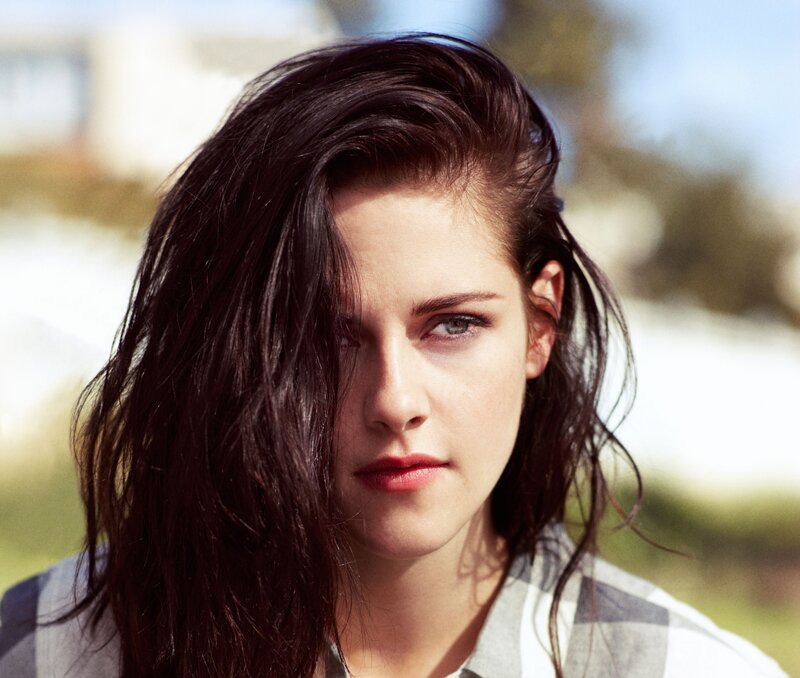 woman with dark hair looking at camera