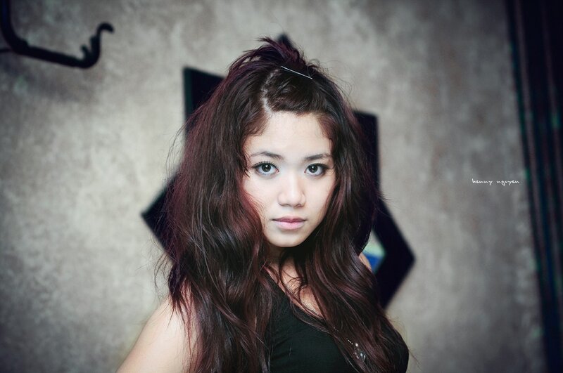 woman with dark hair looking at camera