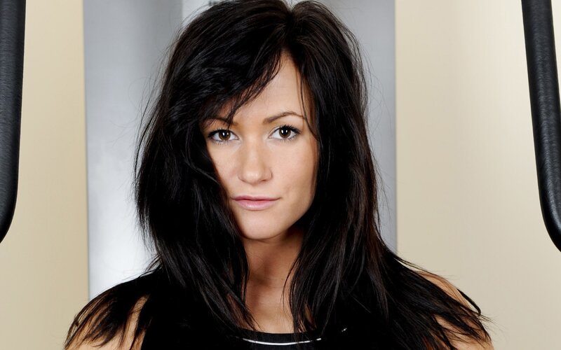 woman with dark hair looking at camera
