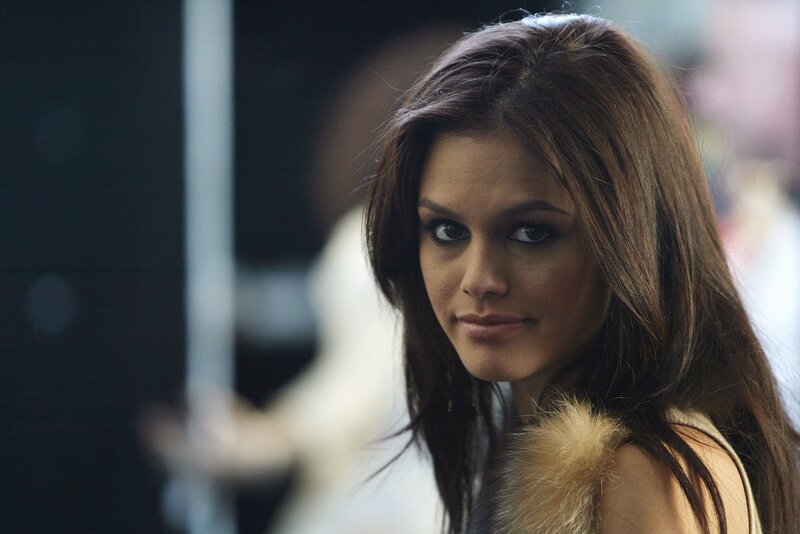 woman with dark hair looking at camera
